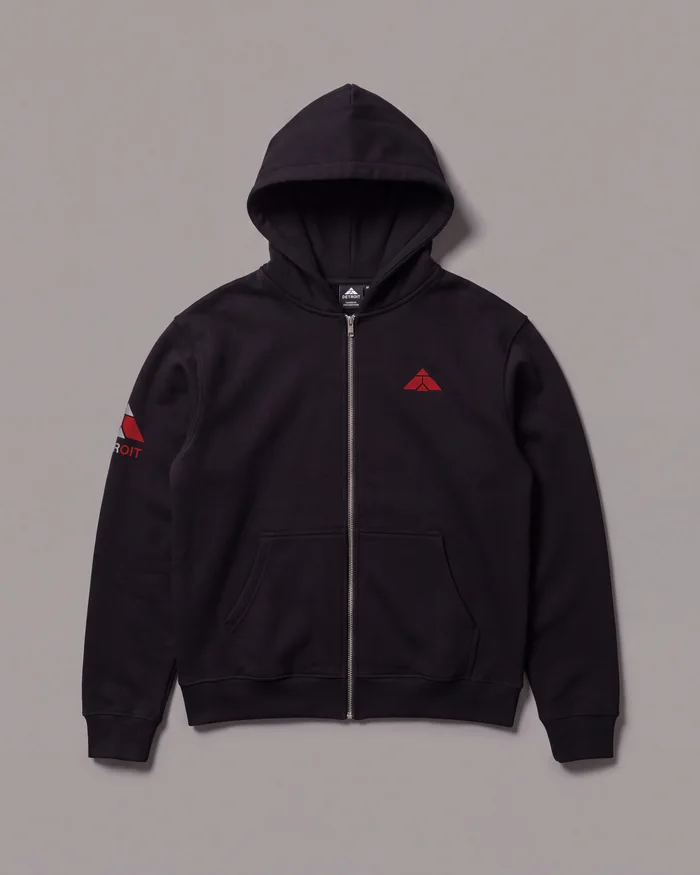 Tuition in black with red lettering, laid flat from the front