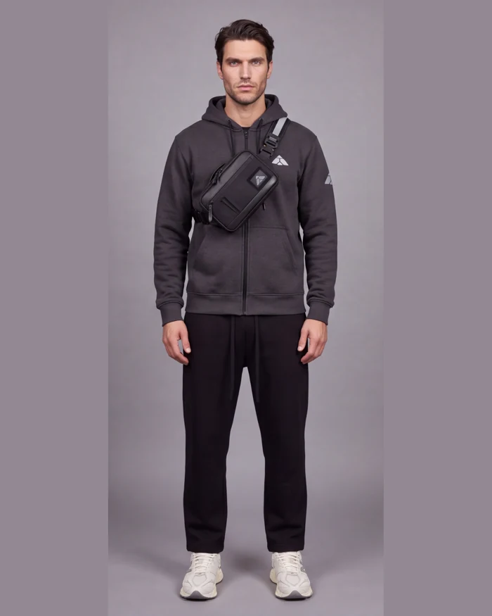 The Carry worn with the charcoal athlete outfit and off-white trainers in the studio