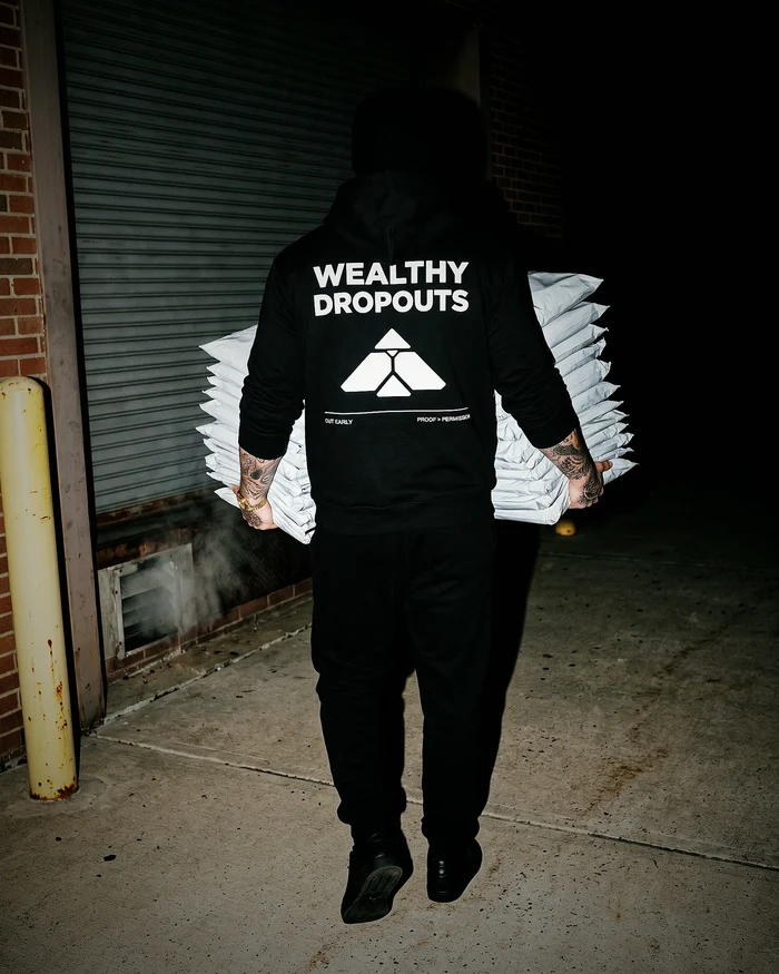 The Audit worn carrying mailers to a loading dock before dawn